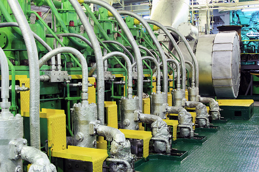 Ship main engine. The interior of the engine room of the ship