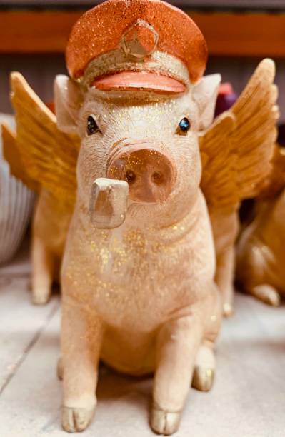 istock Pig with pipe and angel wings 1158463731