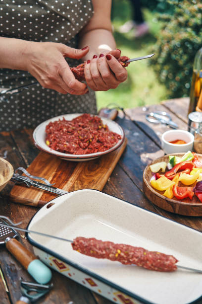 istock Preparing Lamb Kebab Outside in the Garden 1158464295