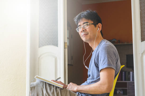 istock Asian man meditating and writing gratitude journal 1158464953
