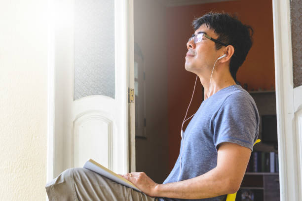 istock Asian man meditating and writing gratitude journal 1158464965