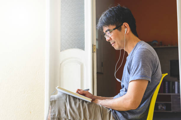 istock Asian man meditating and writing gratitude journal 1158464982