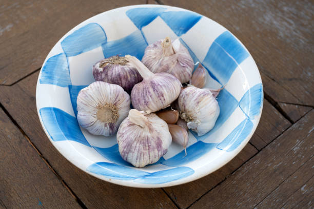 istock bowl full of whole garlic bulbs 1158465199