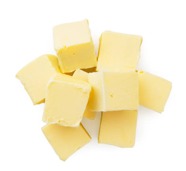 istock Pieces of butter isolated on white background, top view 1158465309
