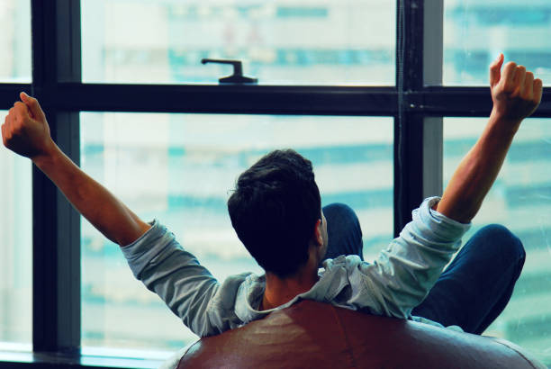 istock Creative man relaxation and happy for work job success in office. 1158465354