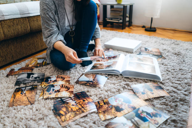 istock Woman looking wedding photos 1158466379