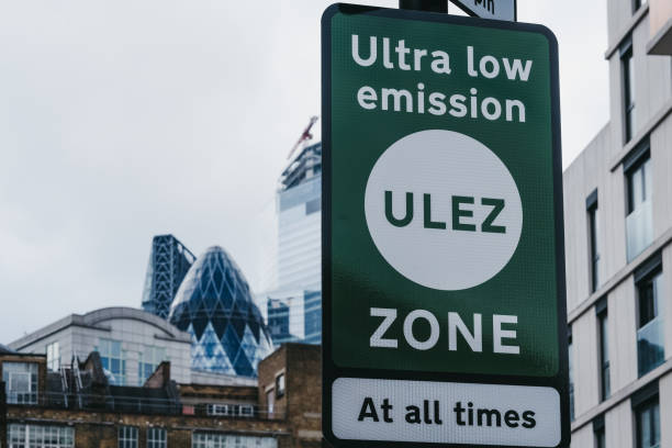 Signs indicating Ultra Low Emission Zone (ULEZ) on a street in London, UK. stock photo