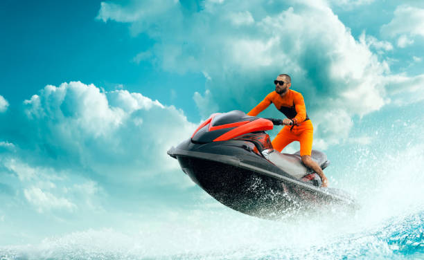 istock Young Man on water scooter. 1158468957