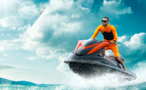 istock Young Man on water scooter. 1158468979