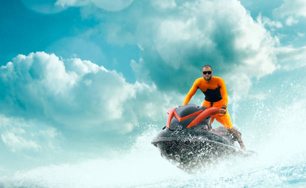 istock Young Man on water scooter. 1158468998