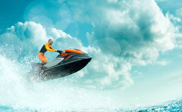 istock Young Man on water scooter. 1158469114