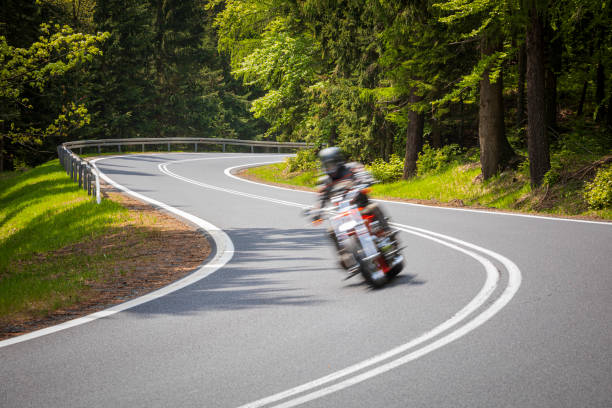 istock motorcyclist riding on the mountain road 1158474919
