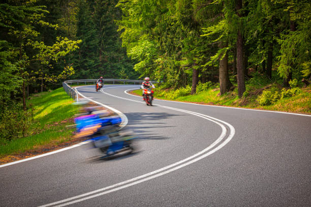 istock motorcyclist riding on the mountain road (HDRi) 1158474920
