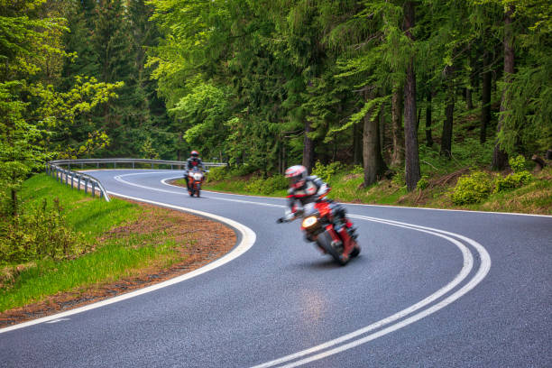 istock motorcyclist riding on the mountain road (HDRi) 1158474924