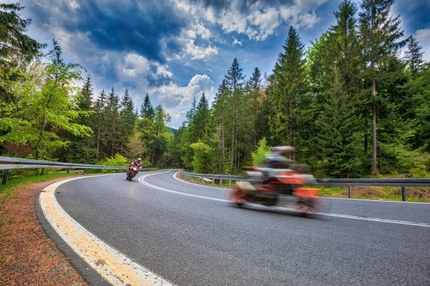 istock motorcyclist riding on the mountain road (HDRi) 1158474928