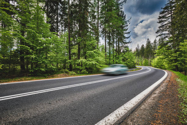 istock car riding on the mountain road (HDRi) 1158474939