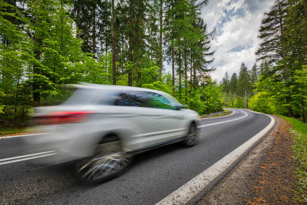 istock car riding on the mountain road (HDRi) 1158474967