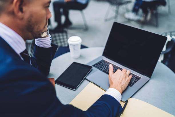 istock Pondering male executive manager working remotely on laptop device with blank screen area for advertising your content text, thoughtful man making accounting online for planning banking operations 1158476112