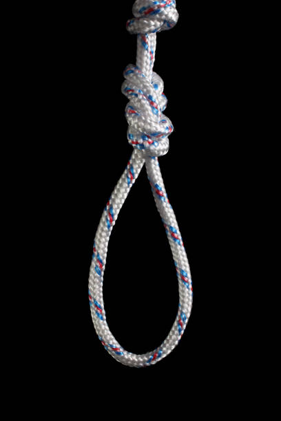 istock Marine knot - Flemish loop (eight), rope isolated on black background. 1158478098