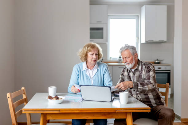 istock Senior Couple Calculating Bills 1158479298