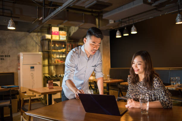 istock Insurance broker with small restaurant business owner 1158479374