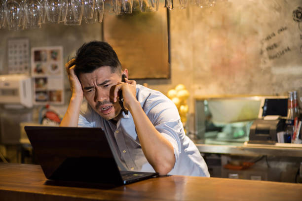 istock Small restaurant business owner stressed with laptop 1158479519