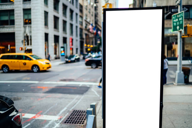 istock Clear empty billboard with copy space area for advertising text message or content, public information board in urban scene,street Lightbox with city and people on background, promotional sale mock up 1158479651