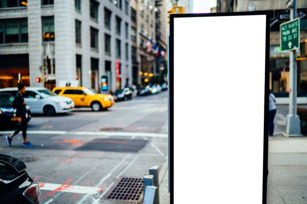 istock Clear empty billboard with copy space area for advertising text message or content, public information board in urban scene,street Lightbox with city and people on background, promotional sale mock up 1158479655