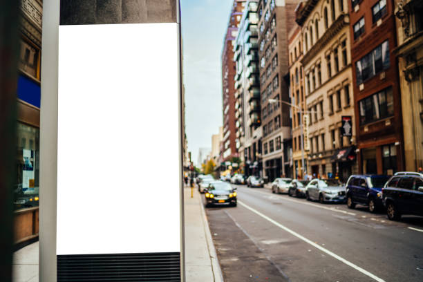 istock Clear empty billboard with copy space area for advertising text message or content, public information board in urban scene, street Lightbox with city scene on background, promotional sale mock up 1158479665