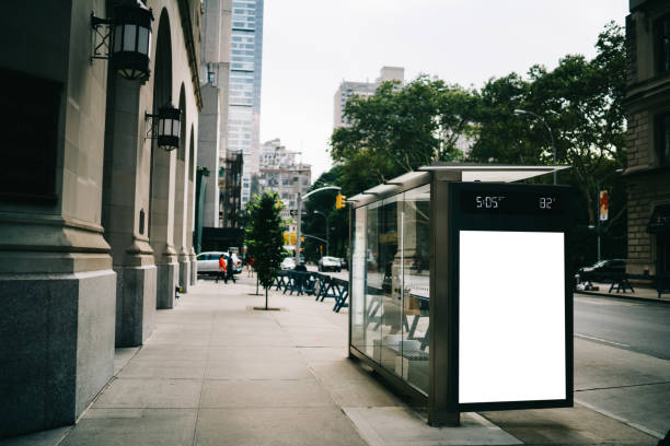 istock Bus station billboard with blank copy space screen for advertising text message or promotional content, empty mock up Lightbox for information, stop shelter clear poster display in urban city street 1158480173