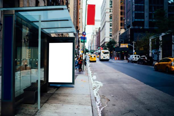 istock Bus station billboard with blank copy space screen for advertising text message or promotional content, empty mock up Lightbox for information, stop shelter clear poster display in urban city street 1158480177