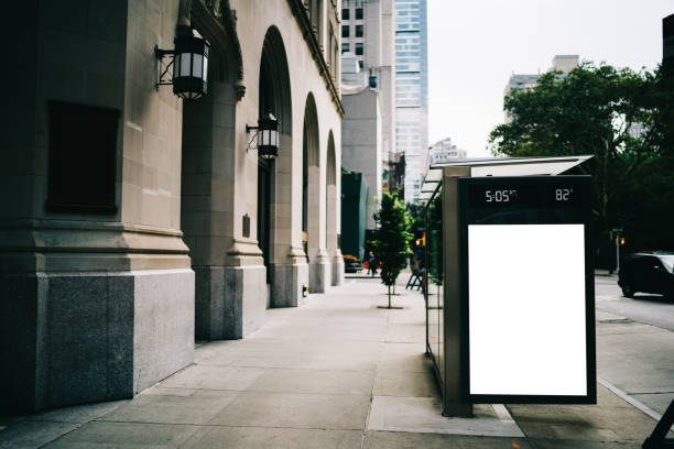 istock Bus station billboard with blank copy space screen for advertising text message or promotional content, empty mock up Lightbox for information, stop shelter clear poster display in urban city street 1158480178