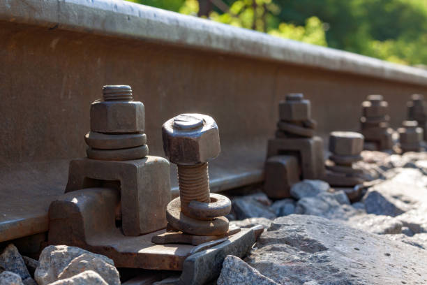 railway tracks need repair and maintenance. unscrewed bolt.