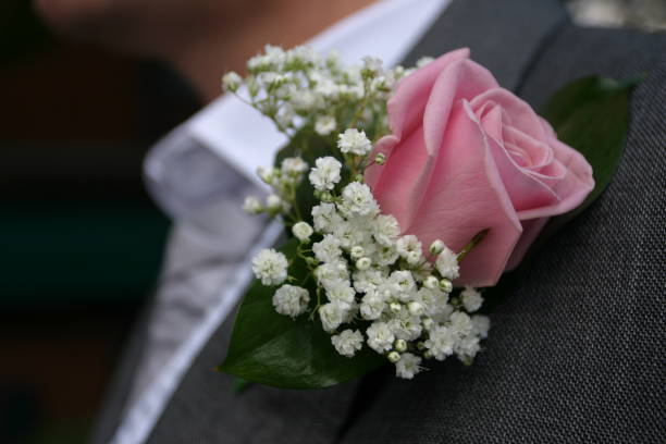 istock Groom Wearing Pink Rose Buttonhole 1158480546