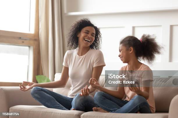 Healthy Happy African Mother Teaching Yoga Happy Kid Daughter Laughing Stock Photo - Download Image Now