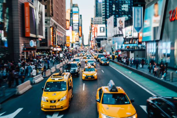 istock Motion blur effect,Times square with illuminated buildings and advertise on front crowded streets and yellow cabs for transportation tourists,midtown in New York with busy traffic and taxi cars moving 1158482150