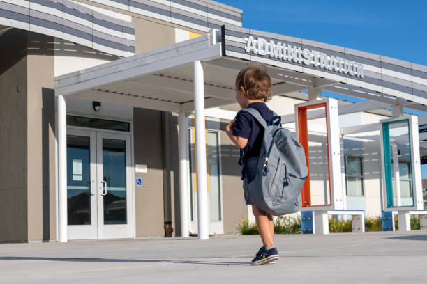 back to school, little boy child walking to his first day of school - little boys preschooler back to school backpack imagens e fotografias de stock