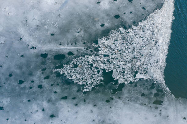 istock Glacier Lagoon with icebergs from above. Aerial View. Cracked Ice from drone view. Background texture concept. 1158483302