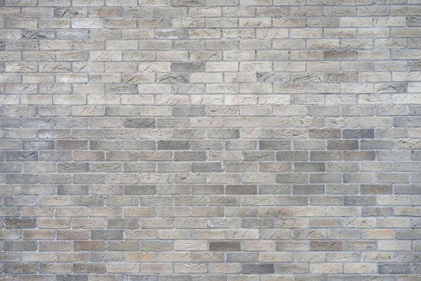 серый фон кирпичной стены - block built structure brick wall wall стоковые фото и изображения