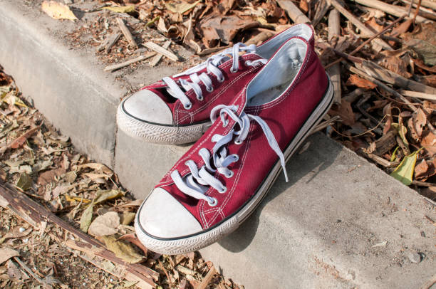istock Pair of worn sneakers 1158486139