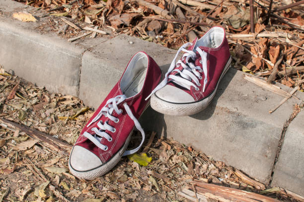 istock Pair of worn sneakers 1158486140