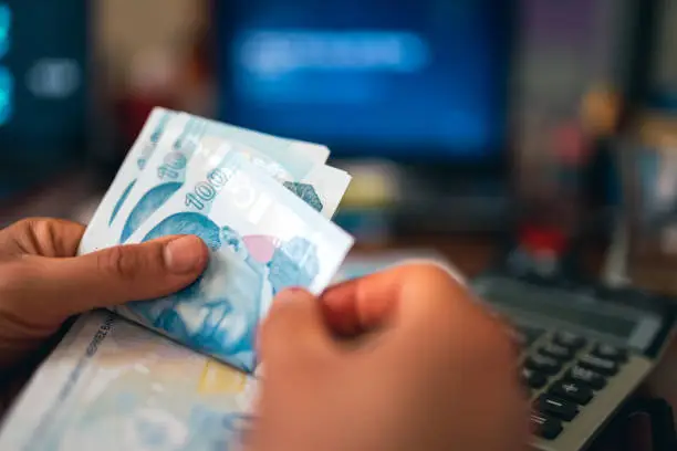 woman hands counting turkish lira in office