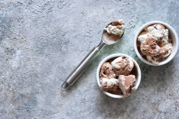 istock Chocolate, vanilla ice cream with chocolate chips and nuts. View from above. 1158489352