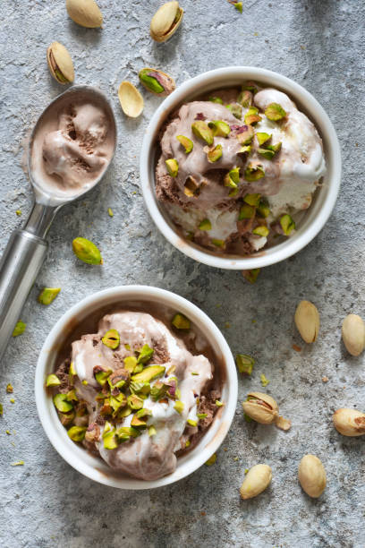 istock Chocolate, vanilla ice cream with pistachios. View from above. 1158489401