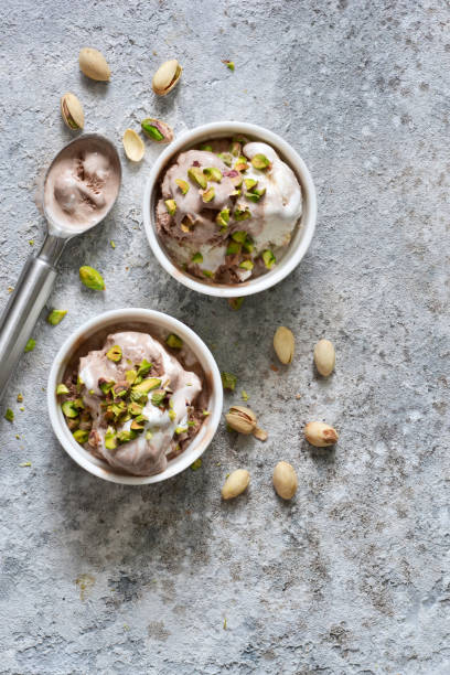 istock Chocolate, vanilla ice cream with pistachios. View from above. 1158489430