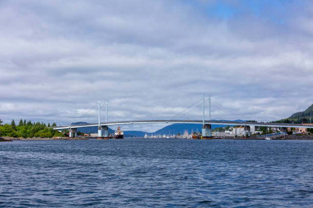 istock Bridge over water with sea-going vessels 1158489513