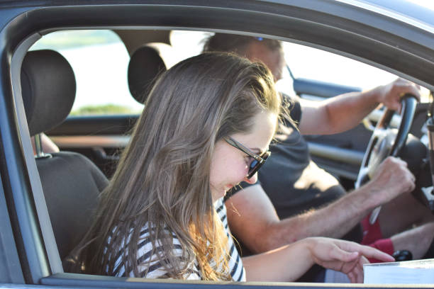 istock Couple sitting in the car. 1158489950
