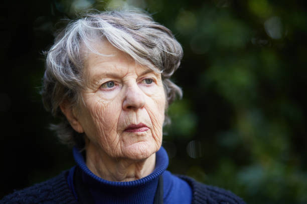 istock Senior woman with a blank expression, possibly suffering from dementia 1158490512
