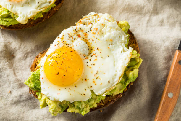 Homemade Avocado Toast with Eggs Homemade Avocado Toast with Eggs for Brunch Avocado Toast with Egg stock pictures, royalty-free photos & images