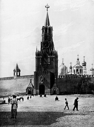 Spasskaya Tower at The Kremlin in Moscow, Russia. The Russian Empire era (circa 19th century). Vintage halftone photo etching circa late 19th century.